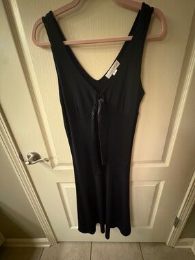 Black dress with silk tie in front.